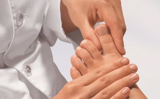 a specialist examines the feet for fungal infection